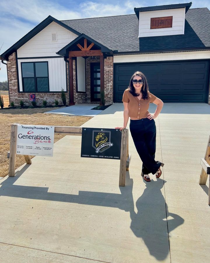 Lyndsee in front of a finished home